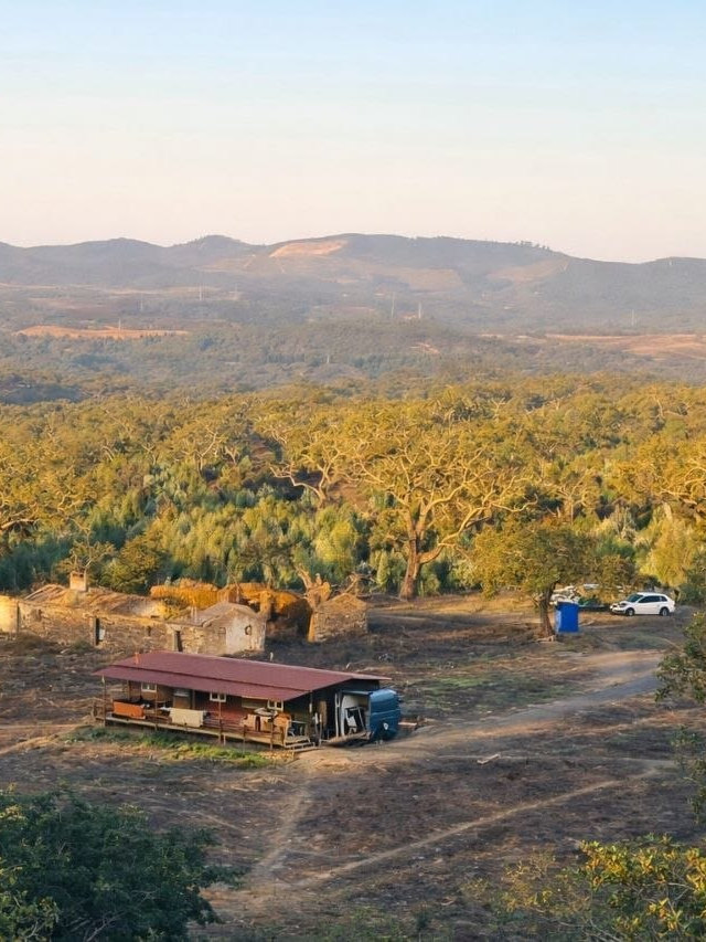 The farm from the hill above it, held in the valley
