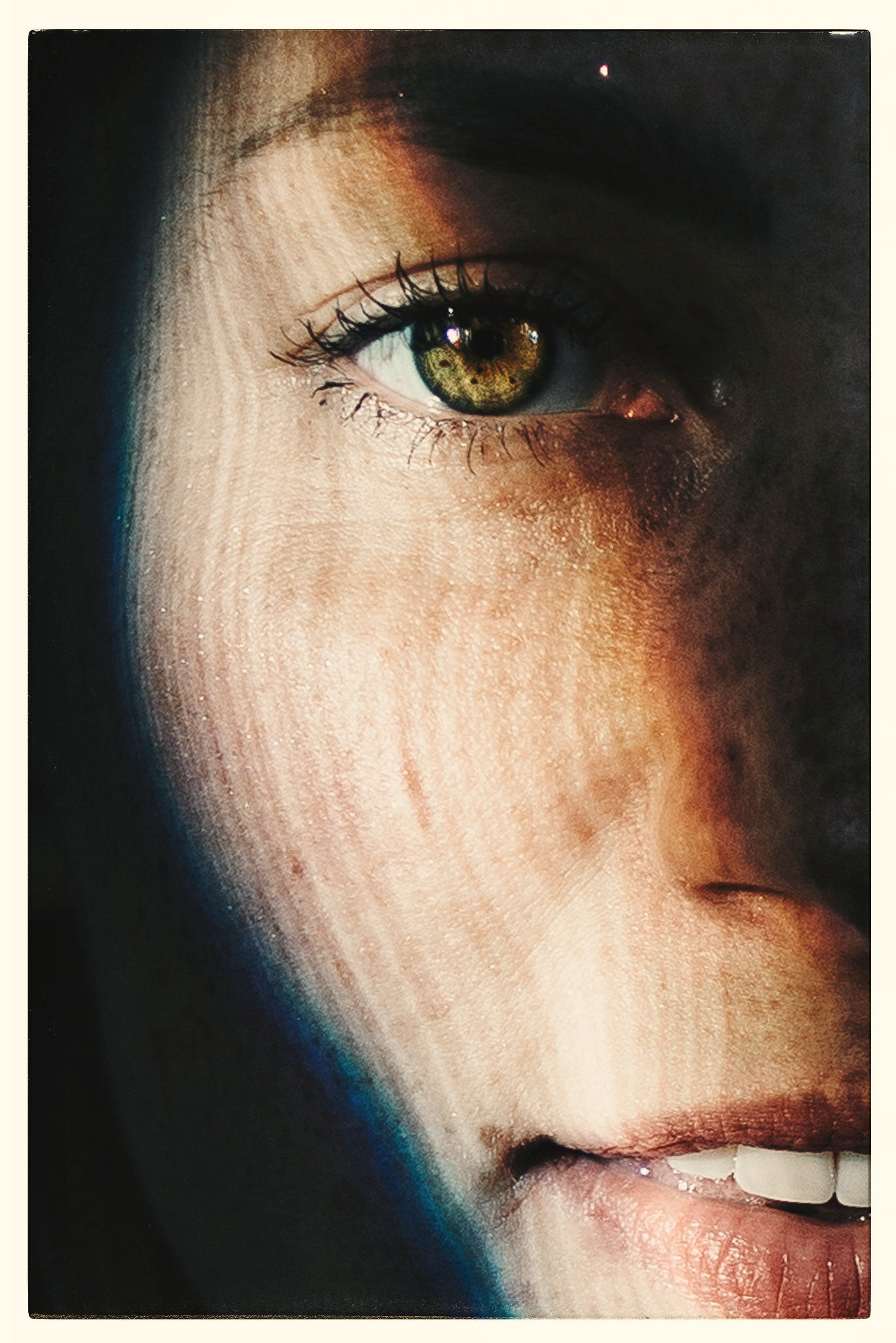 A face in close-up, half in shadow, by Igor Świeczak