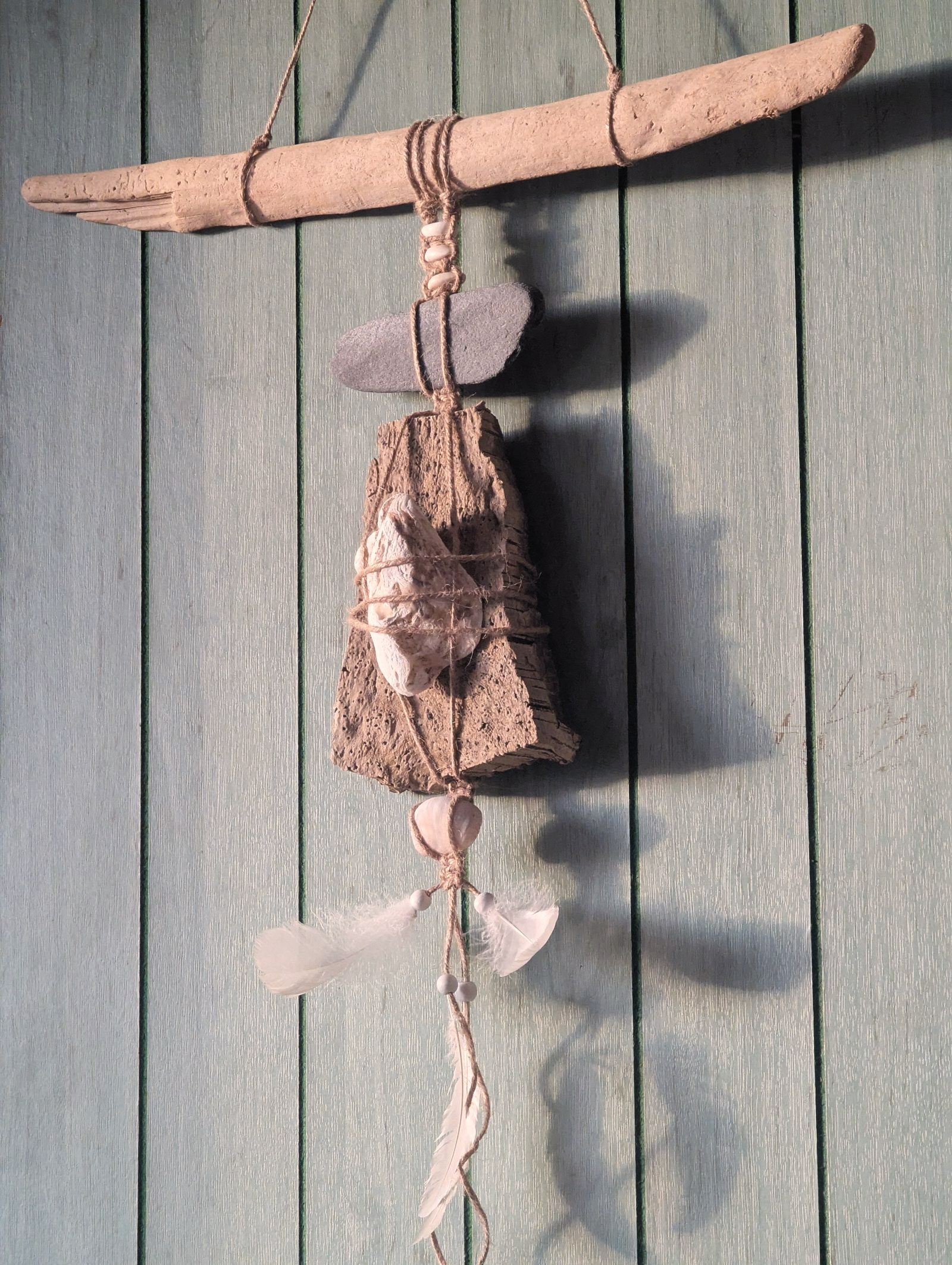 A shell and macramé wall hanging by Philine Allard