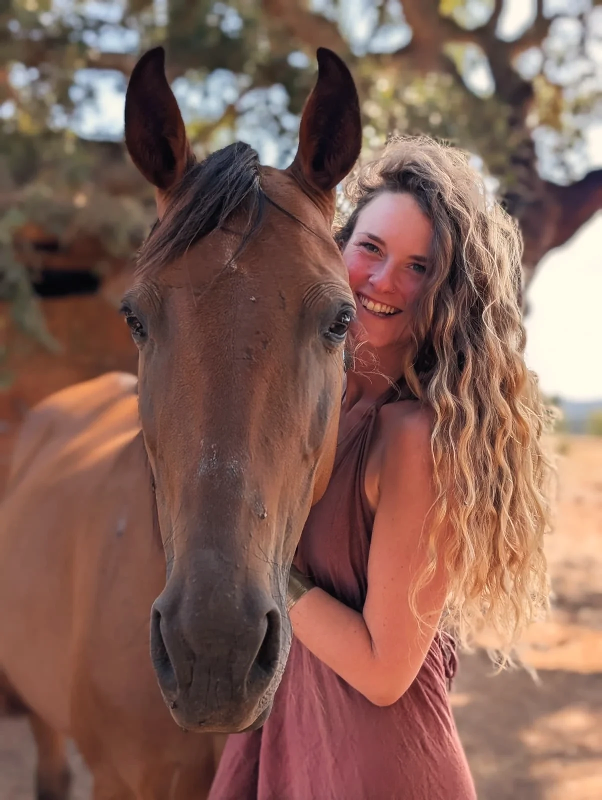 Philine Allard with one of her rescue horses