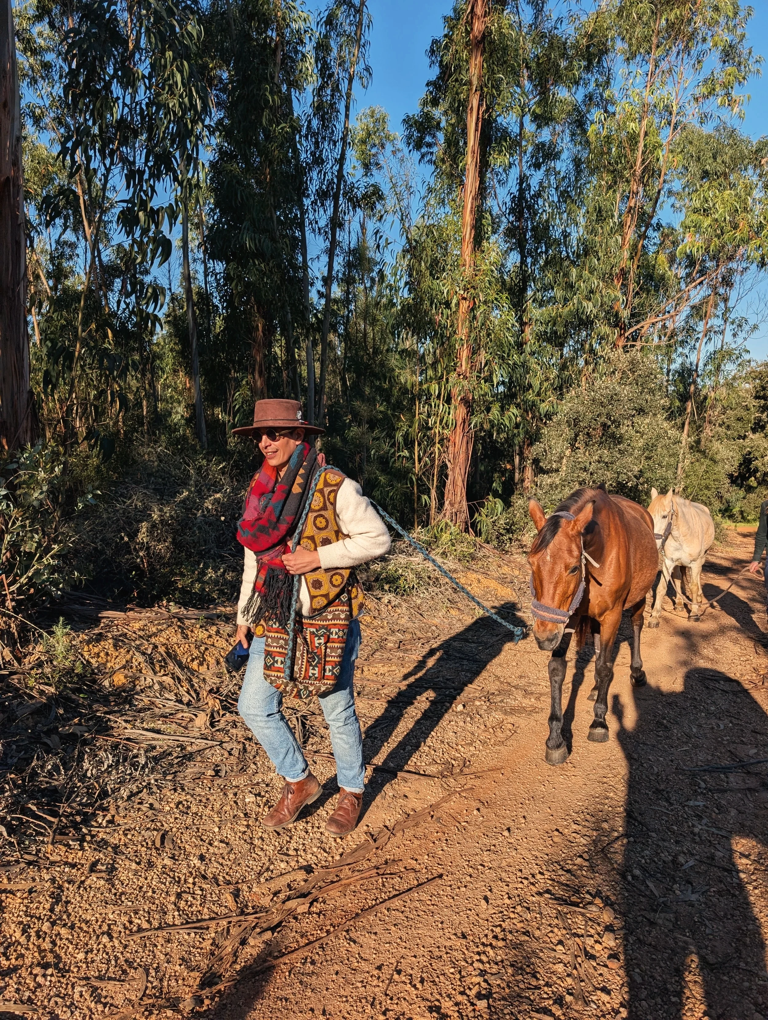 Philine walking a horse through the fields